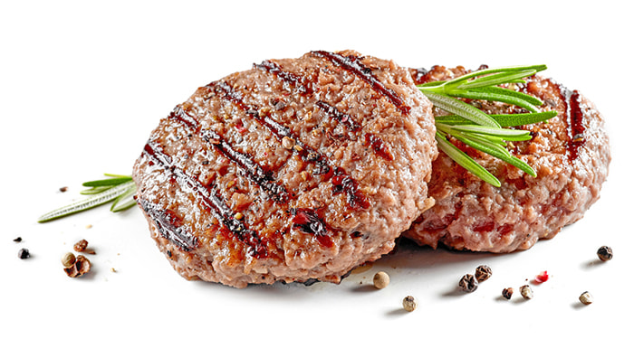 2 burger patties on white isolated background.