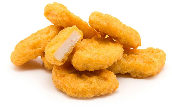 Pile of chicken nuggets on a white isolated background