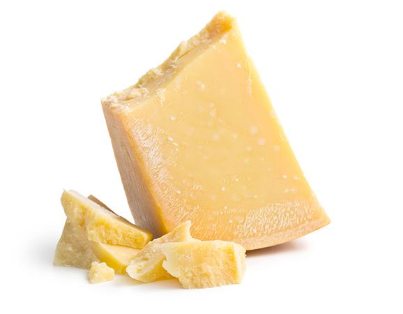 Block of Parmesan cheese on a white isolated background