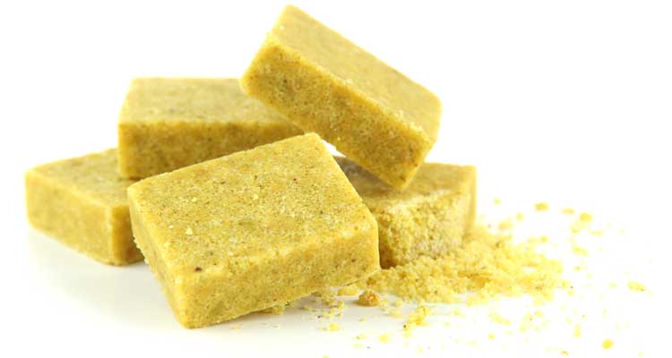 Bouillon cubes in a pile on an isolated white background